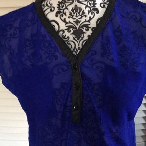 Beautiful blue blouse with black V neck/